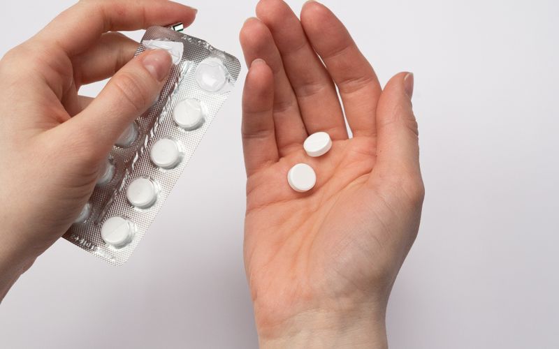 Tablets of medication in a hand