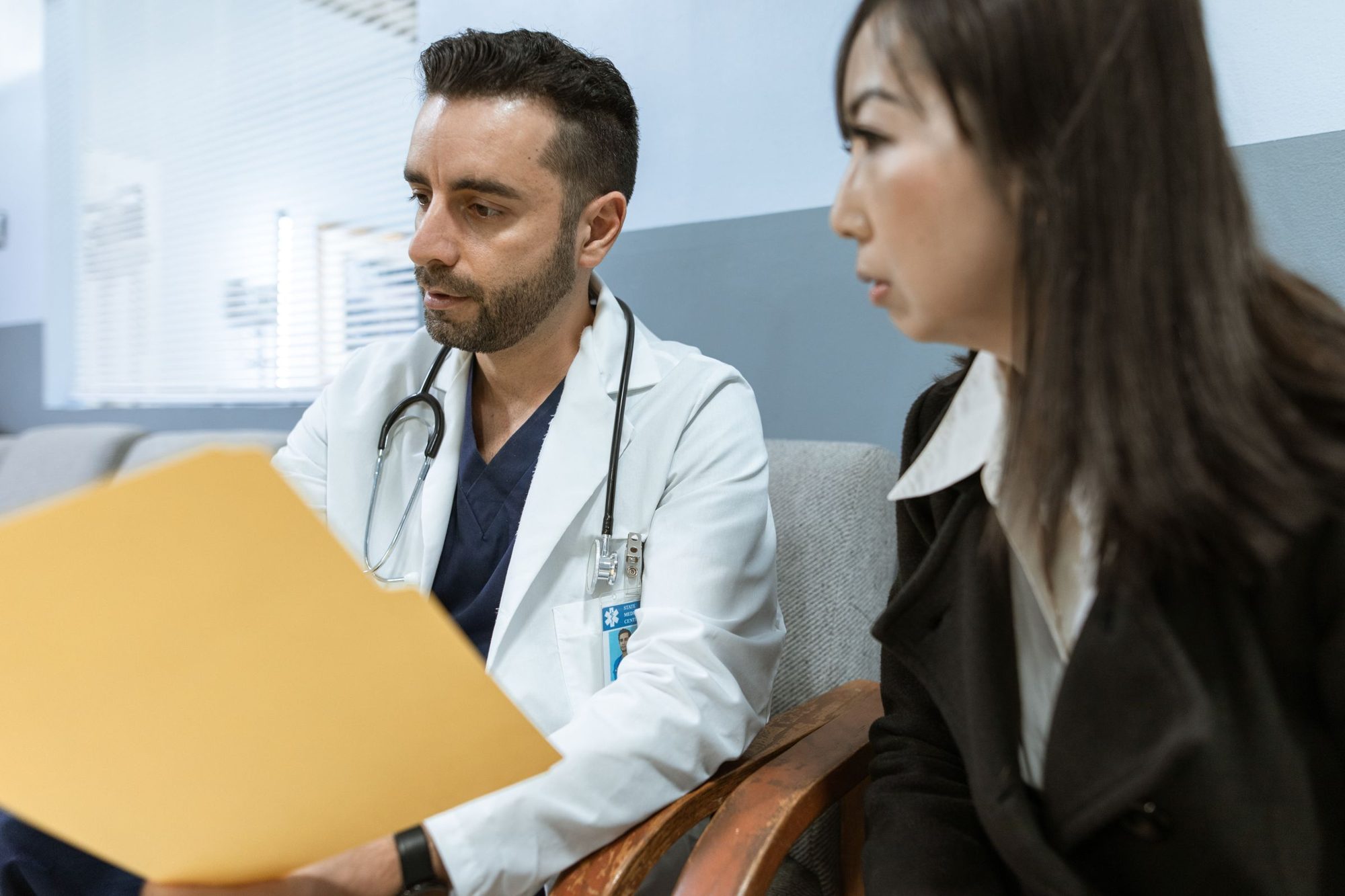 A specialist going over a patient's care plan with her