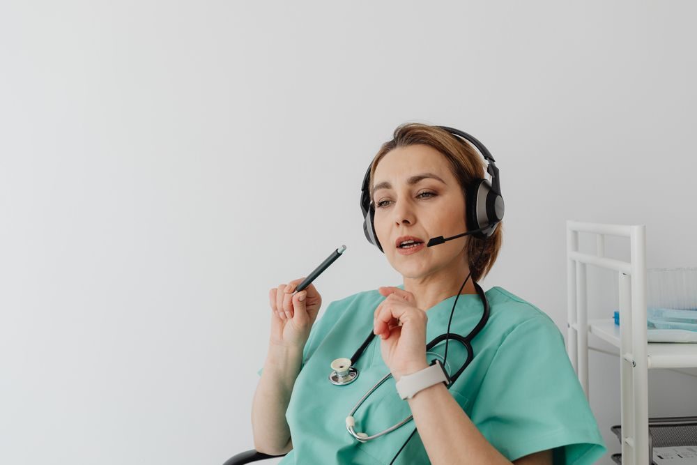 A care team nurse on a call with a headset