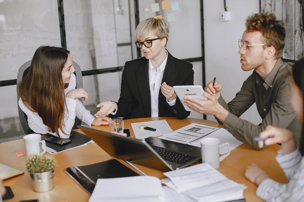 A practice team meeting around a table